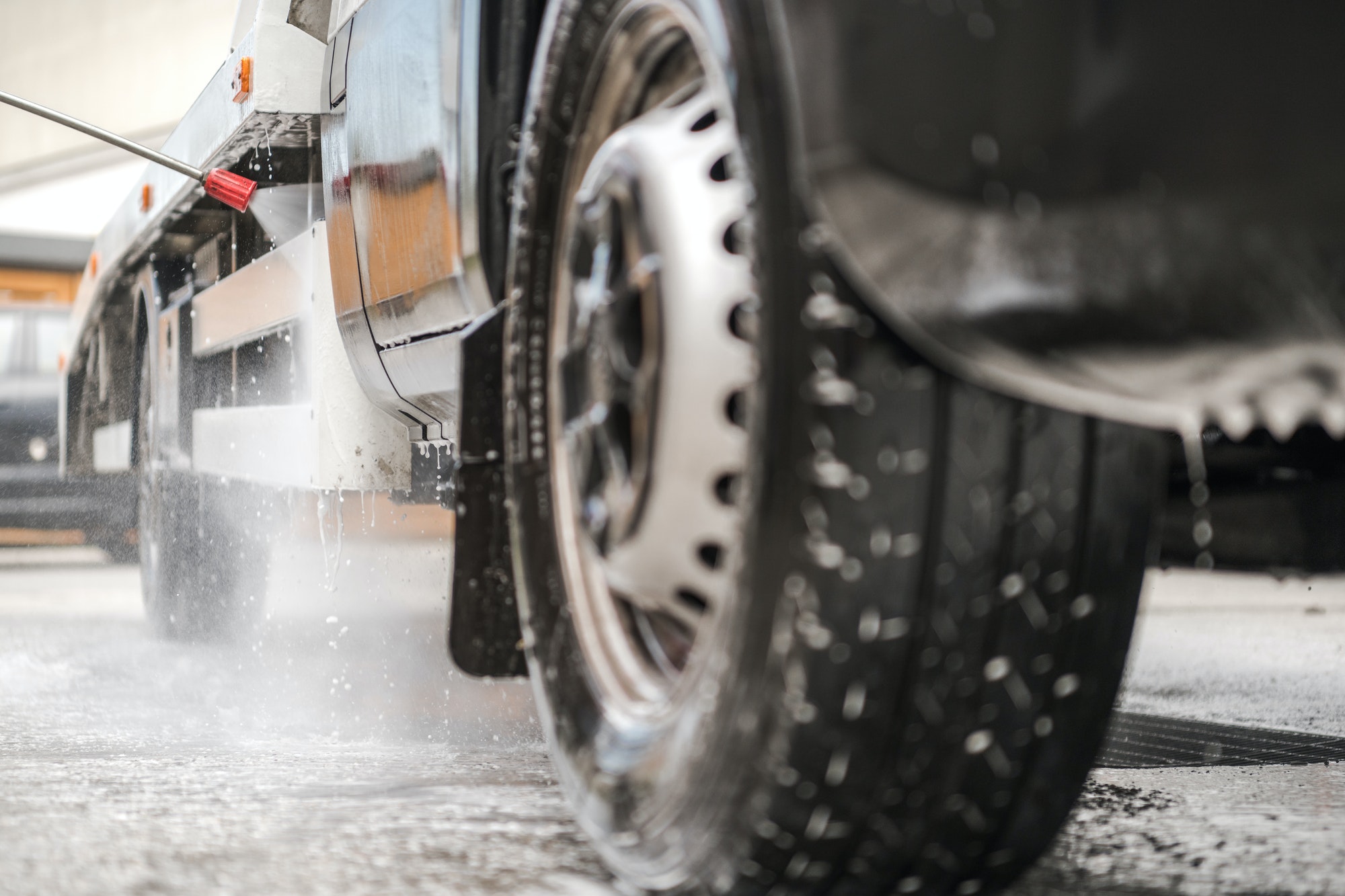 Manual Pressure Washing Truck In Car Wash.